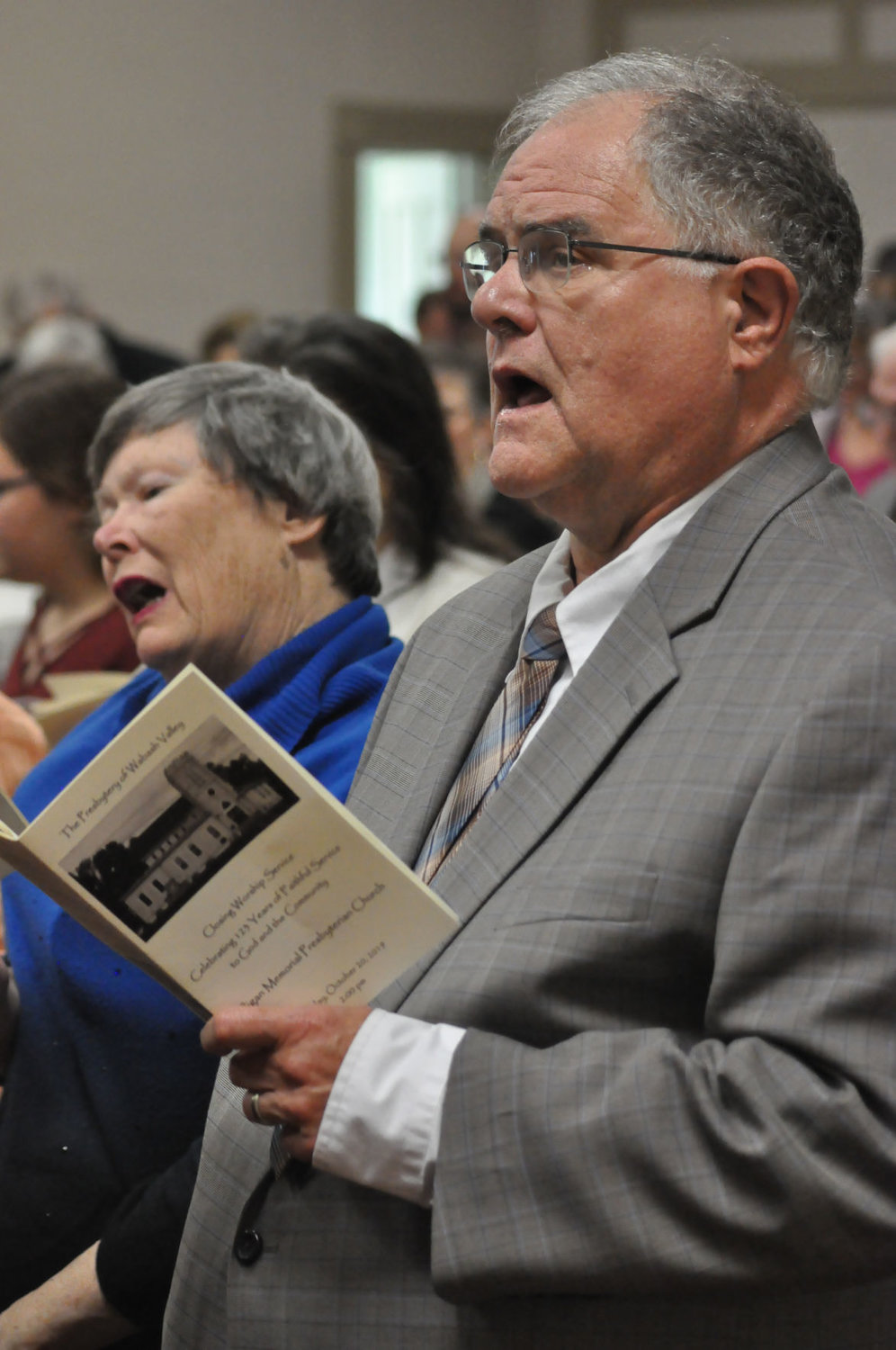 Mark Strothman and his wife, Sharon Maddox, sing during the final worship service Sunday at Milligan Memorial Presbyterian Church. Strothman was pastor of the church in the 1980s.