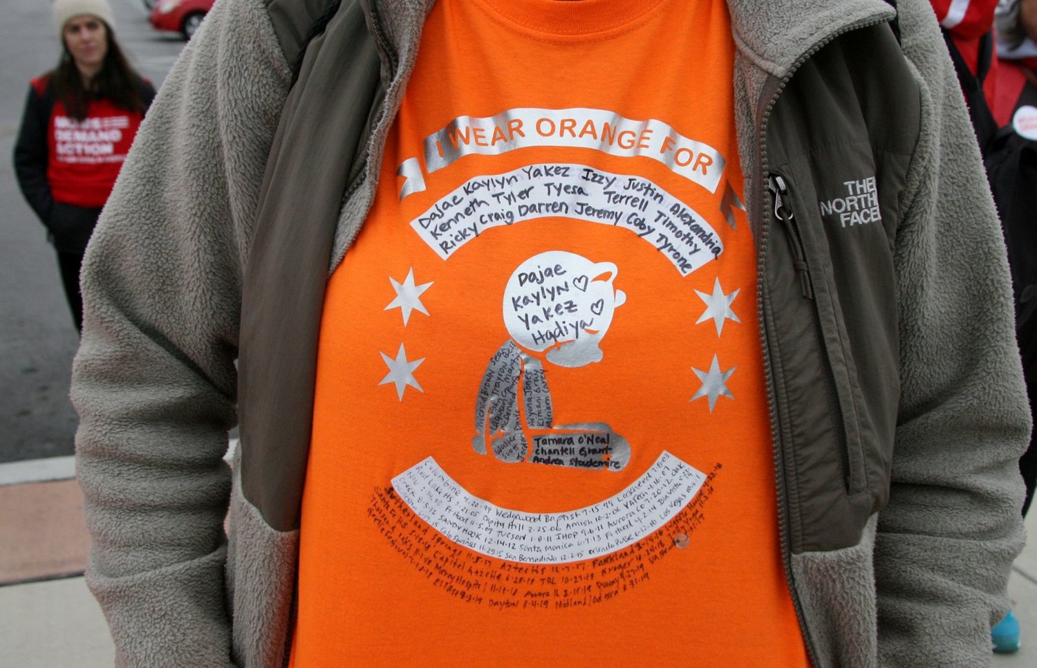 Traci Kurtzer, of Chicago, wears a T-shirt that lists the names of children killed as a result of gun violence for Saturday’s Moms Demand Action march from Hammond to Chicago. Residents of Indiana and Illinois took part in the march, starting from Wolf Lake Park, to promote gun safety.