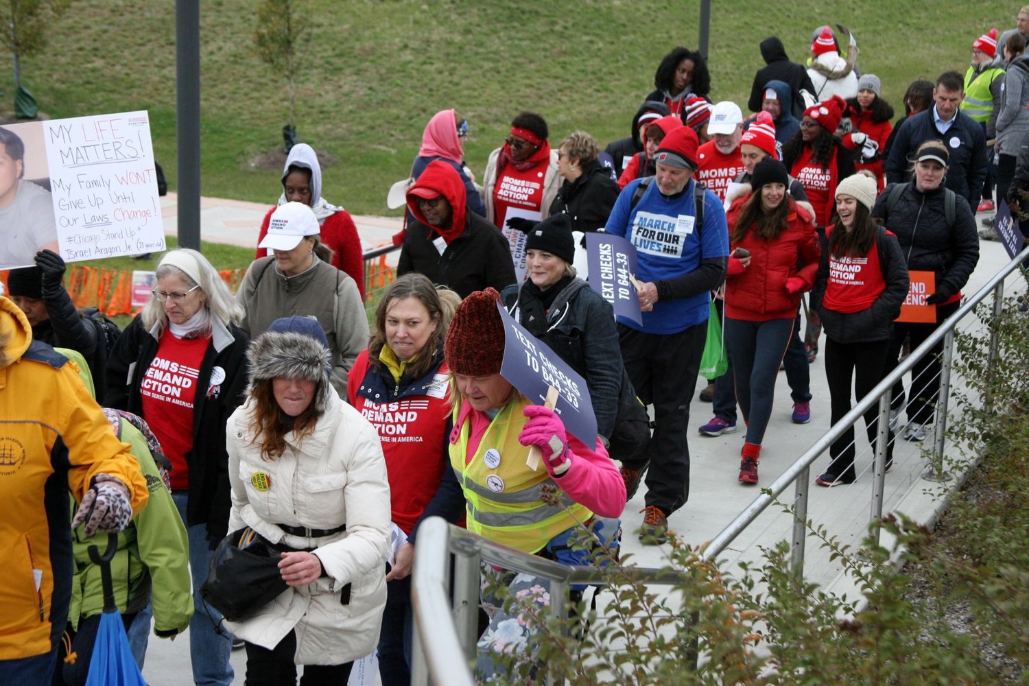Residents of Indiana and Illinois participate in Saturday’s Moms Demand Action march from Hammond to Chicago. The 3.6-mile walk started from Wolf Lake Park.