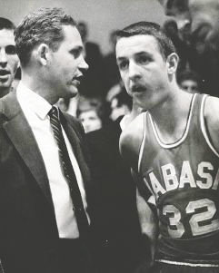 Legendary Wabash coach Bob Brock talks with his star player and Alamo great, Charlie Bowerman during a timeout.