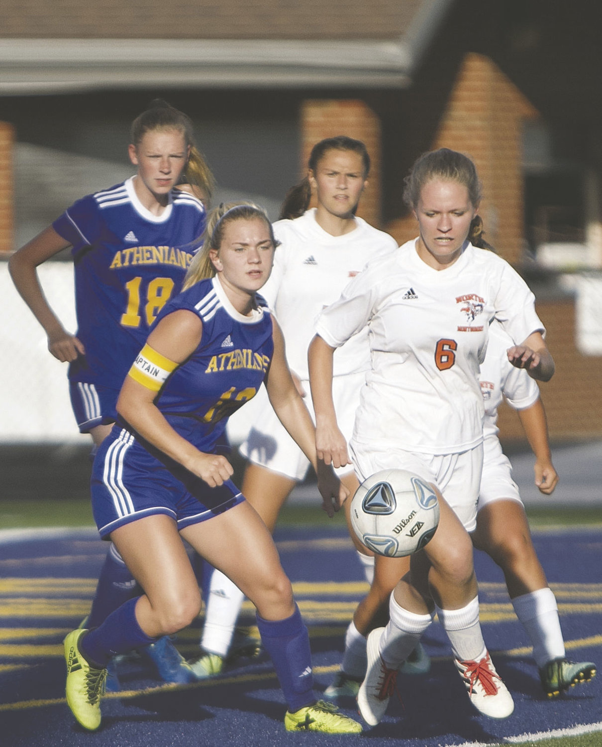 Crawfordsville's Faith Rogers and North Montgomery's Haley Sommer both chase after the ball.