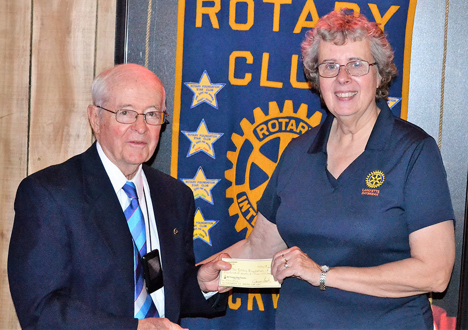 The Rockville Rotary Club recently hosted (on left) Rotary Past District Governor Jim Graham from Brownsburg at their meeting held in the family room at the Thirty-Six Saloon in Rockville. Rockville Rotary president Bonnie Hobbs (on right) presented a check from the Rockville Rotary Club for the polio eradication program known as Polio Plus. Graham shared a PowerPoint presentation about the Rotary Foundation and Polio Plus program. He said polio only remains endemic in three countries: Afghanistan, Nigeria and Pakistan.  Rotary has helped immunized over 2.5 billion children in 122 countries during the last 30 years.  It is hoped Nigeria can be declared polio free by the end of this year.