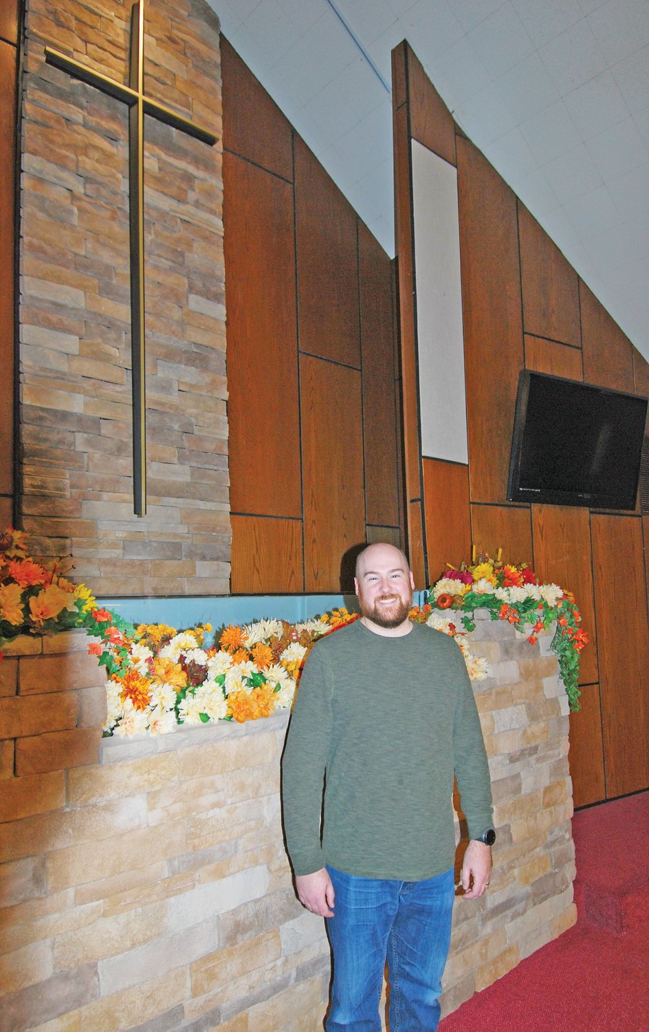 Wayne Wilkinson stands in the sanctuary of Woodland Heights Christian Church. Wilkinson recently began duties as worship minister.