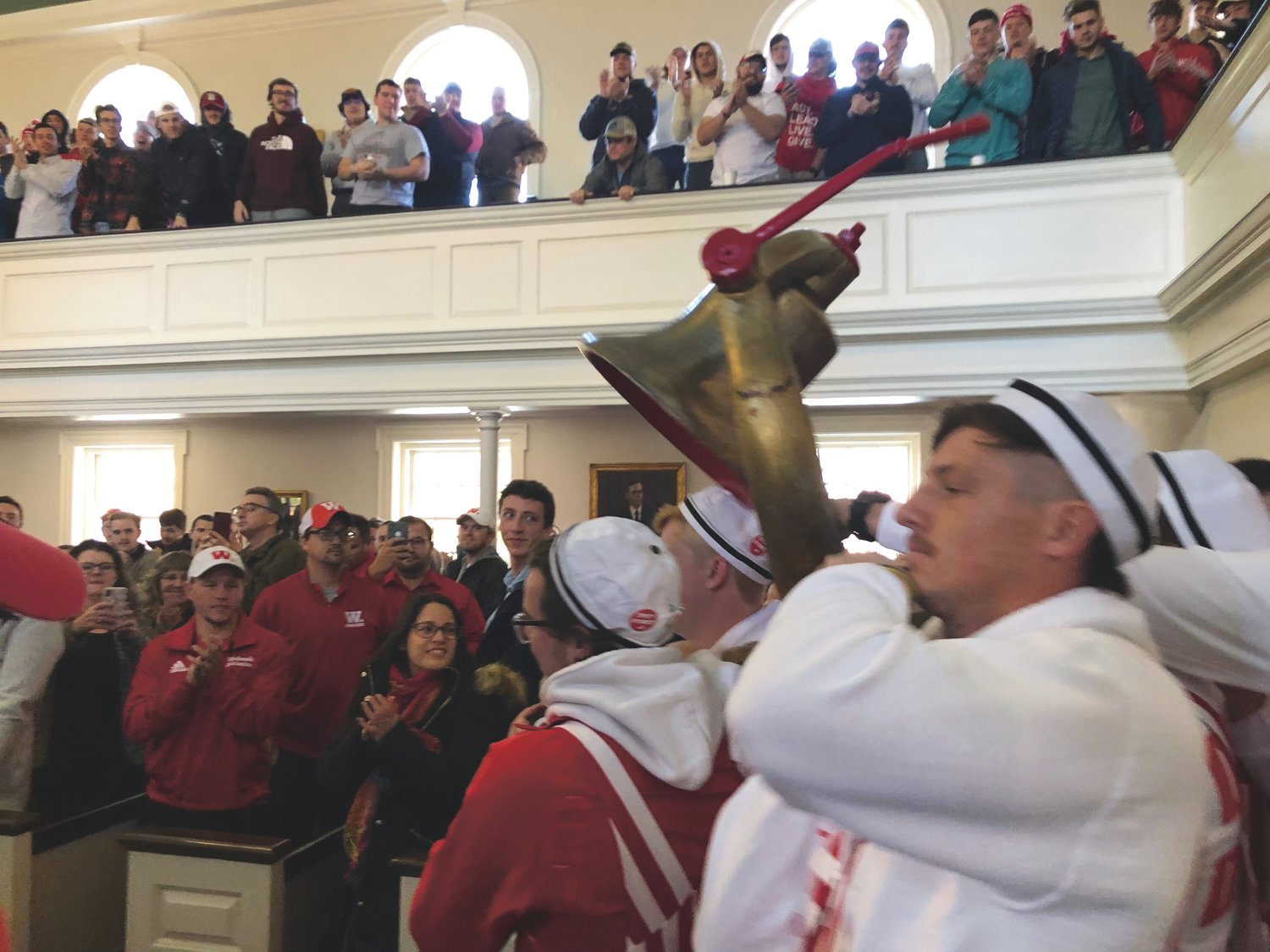 Members of the Wabash Sphinx Club carry the Monon Bell into the Wabash Chapel on Thursday morning for the annual Bell Week Chapel. The Little Giants travel to Greencastle on Saturday for the 126th annual Monon Bell Classic.
