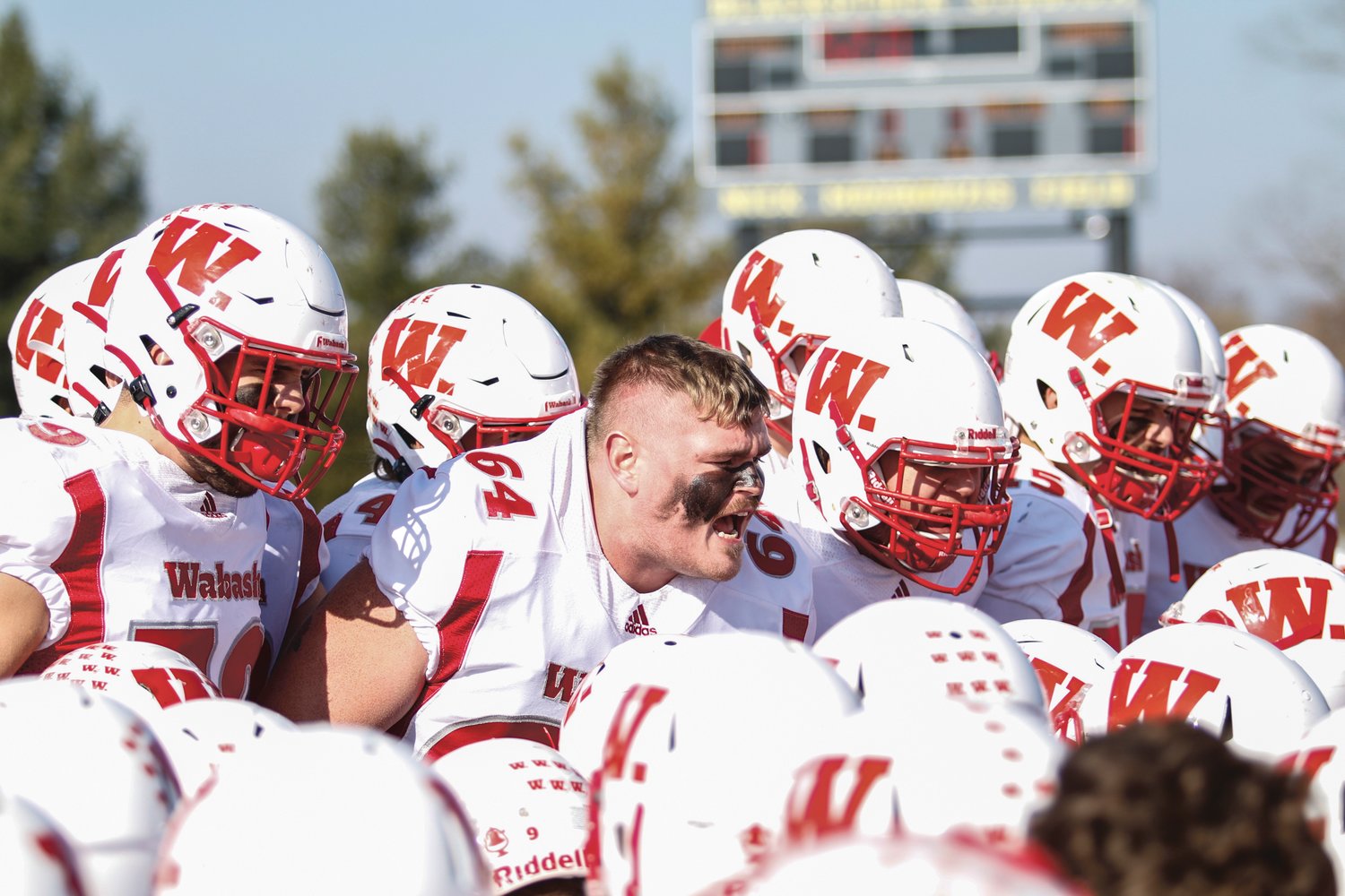 Wabash senior Jake Slager leads the seniors in a chant during the 126th Monon Bell Classic.