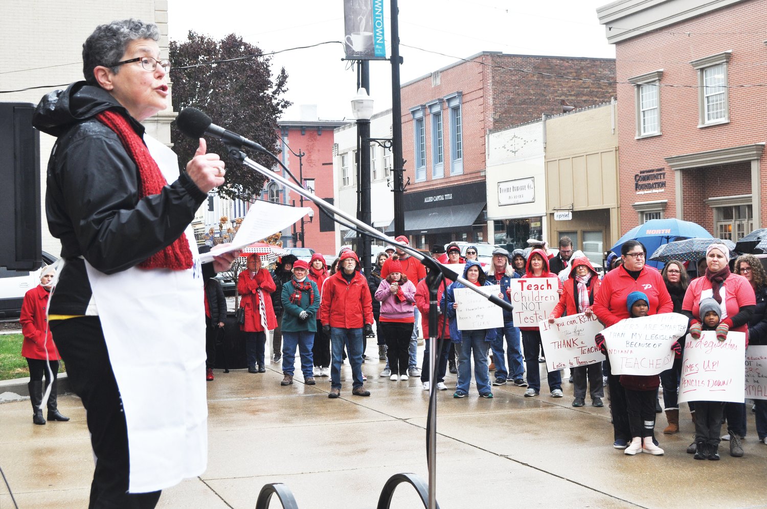 Retired Crawfordsville schools superintendent Dr. Kathy Steele speaks at the local Red for Ed rally Tuesday outside the Montgomery County Courthouse.