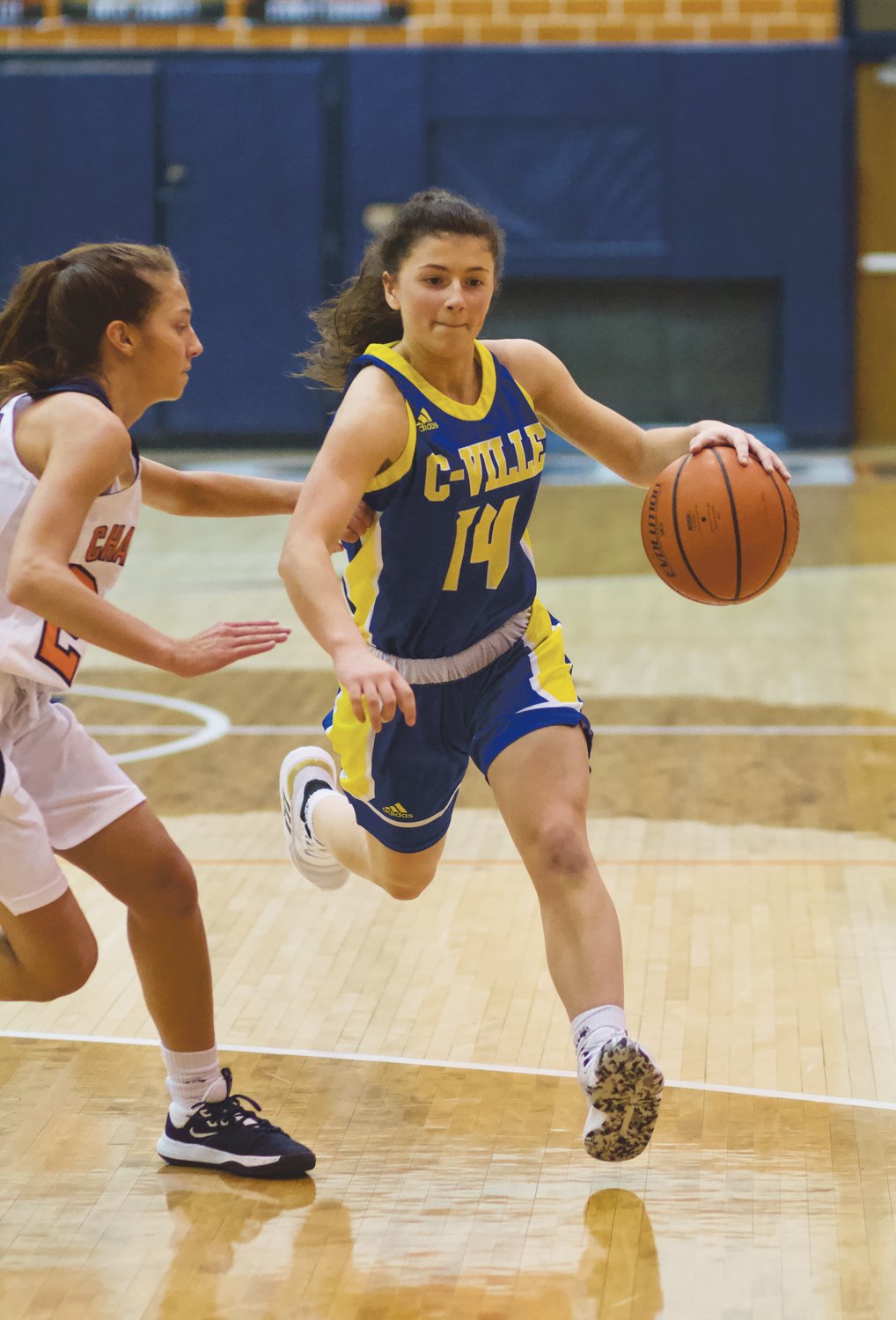 Crawfordsville's Shea Williamson drives past North Montgomery's Maddie Moseley. Williamson led the Athenians with 16 points in their loss to the Chargers.
