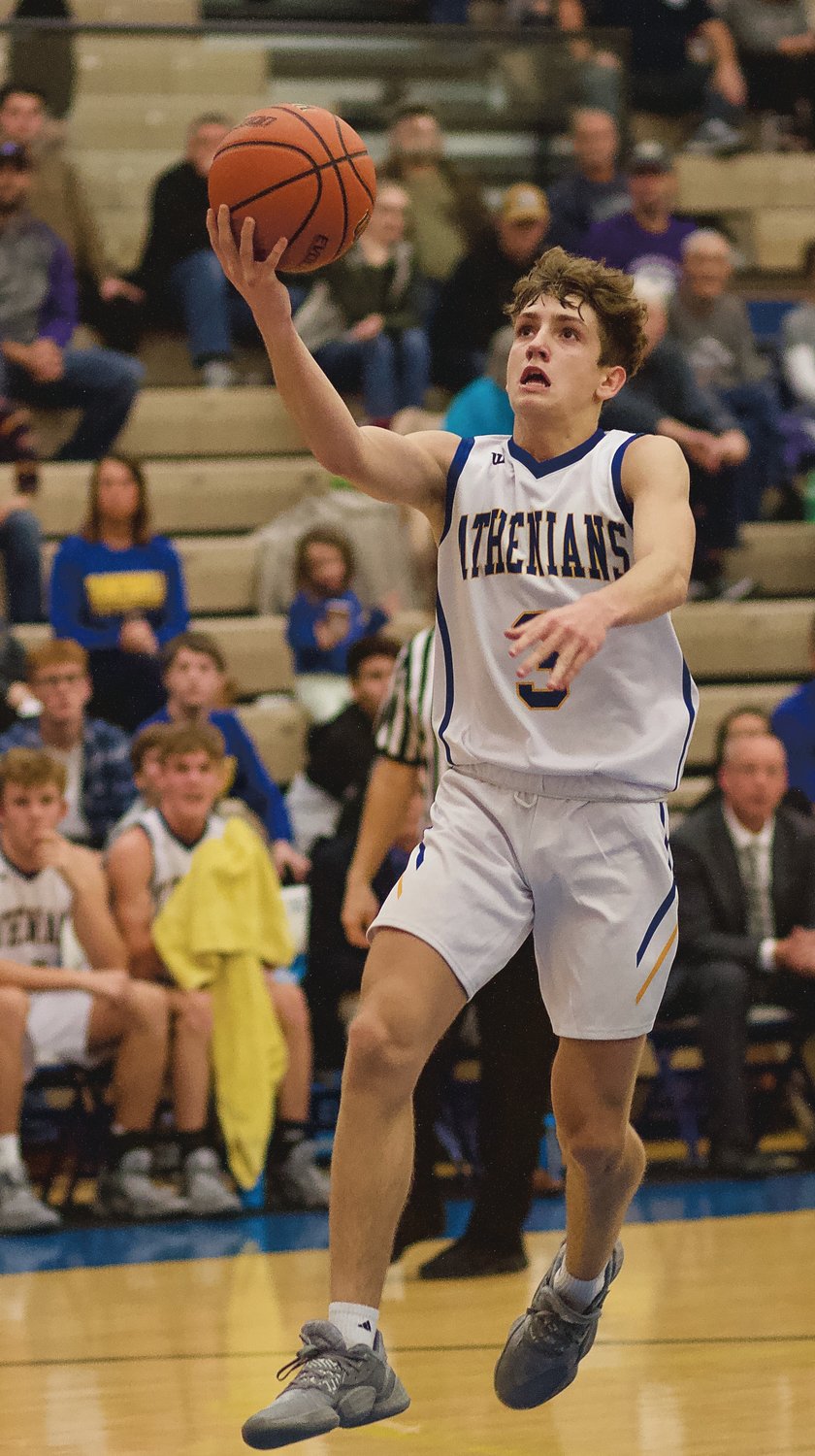 Ty Lynas swoops in for an easy layup in the Athenians 55-49 opening season loss to Greencastle.