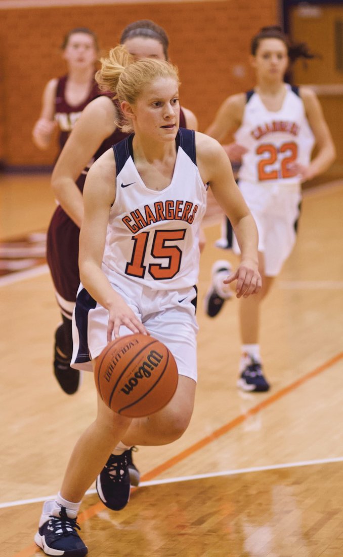Madi Welch drives to the hoop in the Chargers 57-49 win over Faith Christian. Welch had 11 points.