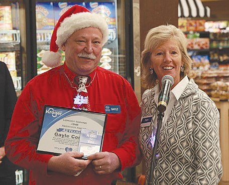 Gayle Conway, left, the longest-serving employee at Kroger South, poses with Pam Matthew, Kroger central division president.