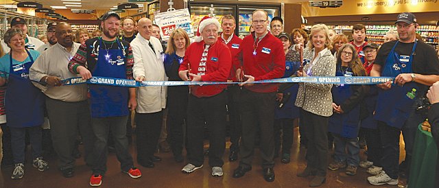 The Crawfordsville Kroger team cuts the ribbon Wednesday morning.