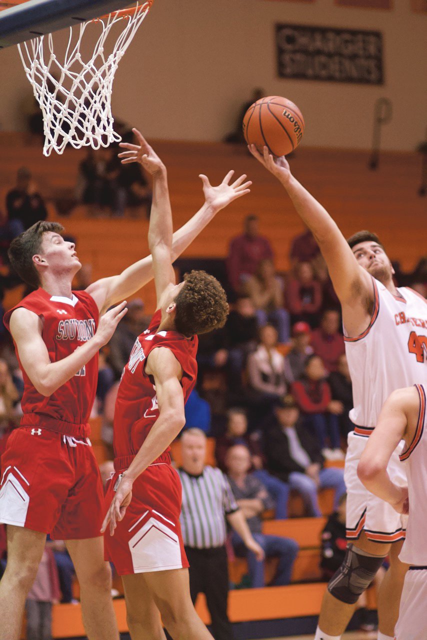 Southmont's Austin Bowman defends North Montgomery's Jack Thompson in the lane.