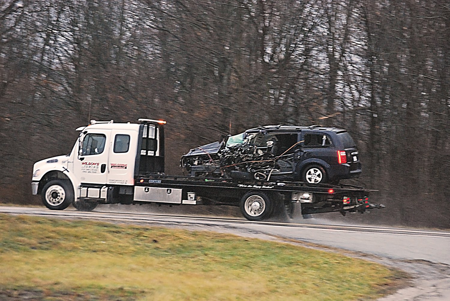 Jim Shelton/Journal Review Photos
A tow truck removes the 1999 Dodge Grand Caravan from the crash scene Monday on State Road 32, just east of C.R. 900E. The van driver, Timothy L. Steele, 58, of Ladoga was pronounced dead at the scene.