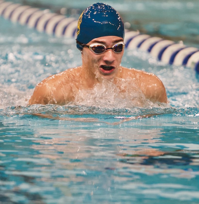 Hunter Conrad competes in the breaststroke for the Athenians, finishing second.