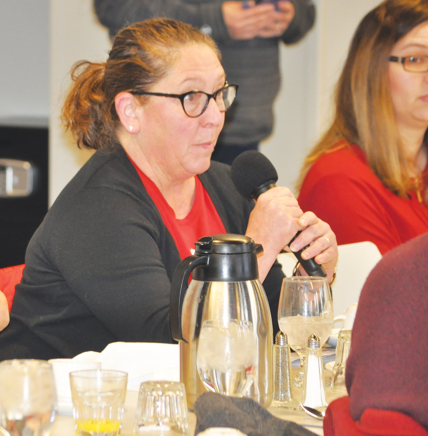Teacher Liz Oshel asks a question Saturday at the Crawfordsville/Montgomery County Chamber of Commerce Legislative Breakfast at Fusion 54.