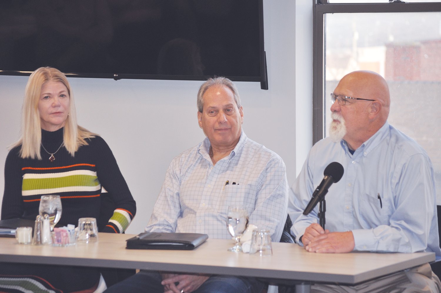 From left, State Rep. Sharon Negele, State Sen. Phil Boots and State Rep. Tim Brown listen to a question Saturday at the Crawfordsville/Montgomery County Chamber of Commerce Legislative Breakfast at Fusion 54.