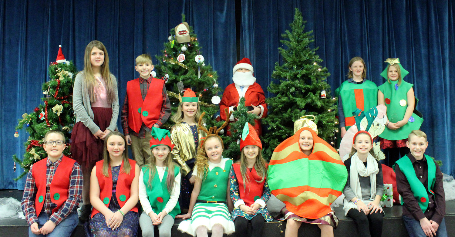 ‘Twas the Night Before Christmas was the theme of the Turkey Run Elementary Christmas program. Each grade level performed special Christmas carols. Fifth grade students served as narrators of the poem, ’Twas the Night Before Christmas. Fifth grade students who served as narrators are, from left, front row, Klayton Burgess, Ella Norman, Brooklynn Reath, Destinee Stevenson, Mackenzie Reath, Ashlyn Bryant, Marlee Jeffers and Logan Mathis; and back row, Jackie Ferguson, Aidan Hart, Carly Newnum, Dylan Lamb, Abby Mathis and Addie Ramsay. The program was directed by music teacher John Huber. The accompanist was Barbara Taylor.