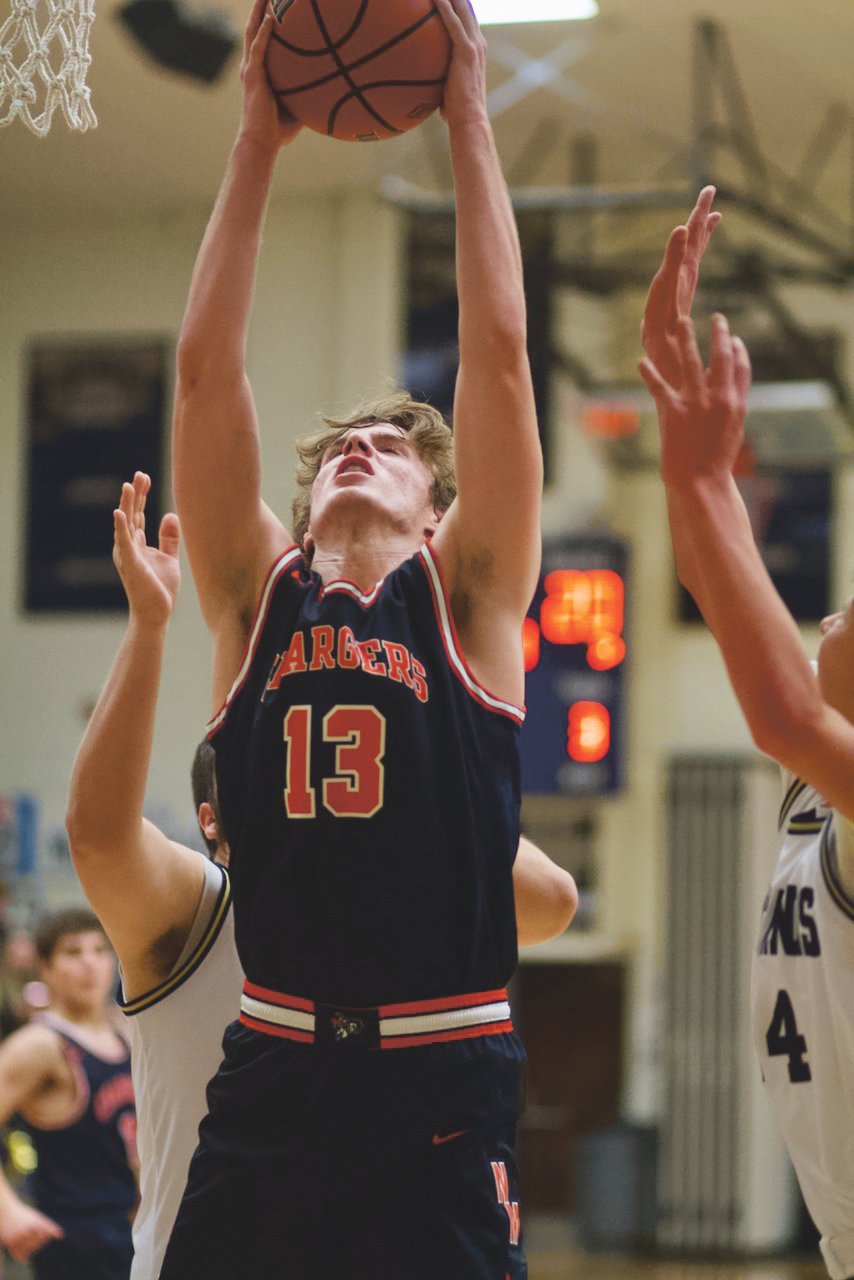 Zak Searle battles for a rebound in a game earlier this season for North Montgomery.