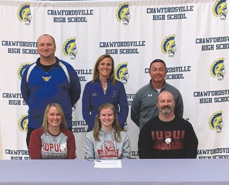 Crawfordsville senior distance runner Madison Fry signed her national letter of intent on Monday to continue her running career at IUPUI. Pictured Above: Front Row - Madison with her parents, Jennifer and Jeremy Fry. Back Row - L-R Crawfordsville track and field coach Sean Gerold, cross country coach Megan Craig, and assistant coach Andy Craig.