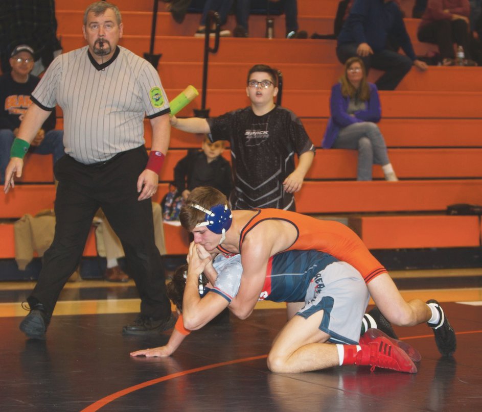 North Montgomery's Gage Galloway looks to turn his Heritage Hills opponent.