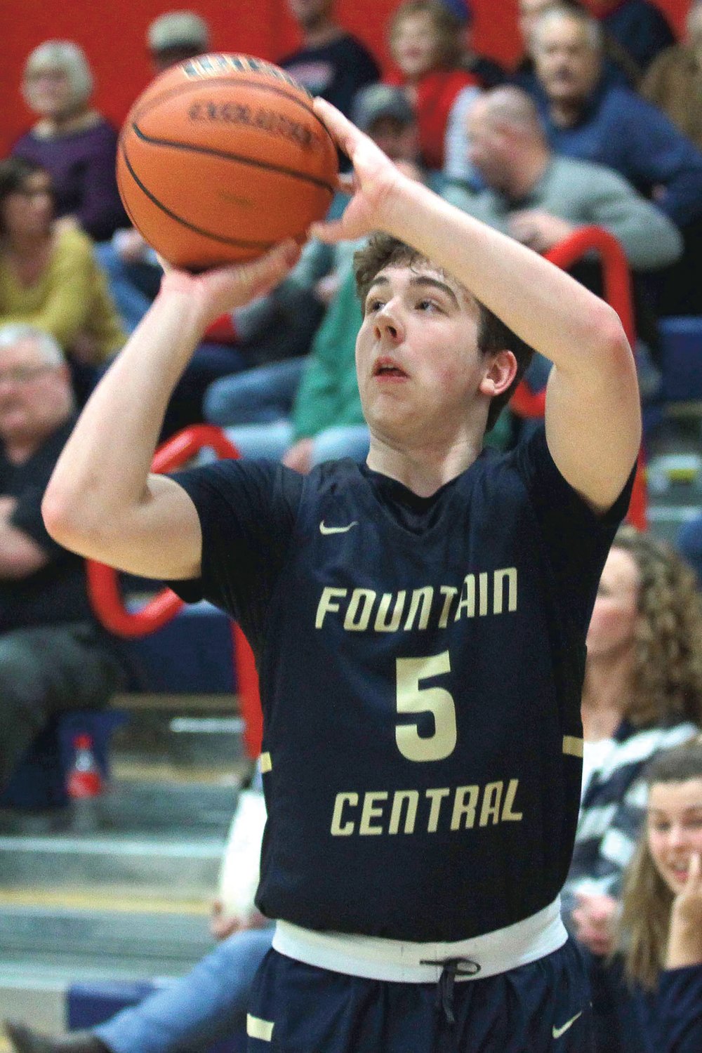 Andrew Shabi of Fountain Central hits one of his three-pointers in the first period.