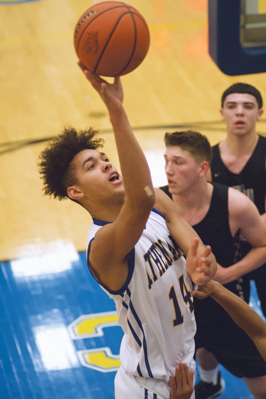 Crawfordsville's Jesse Hall fights through defenders on his way to a bucket against Parke Heritage.
