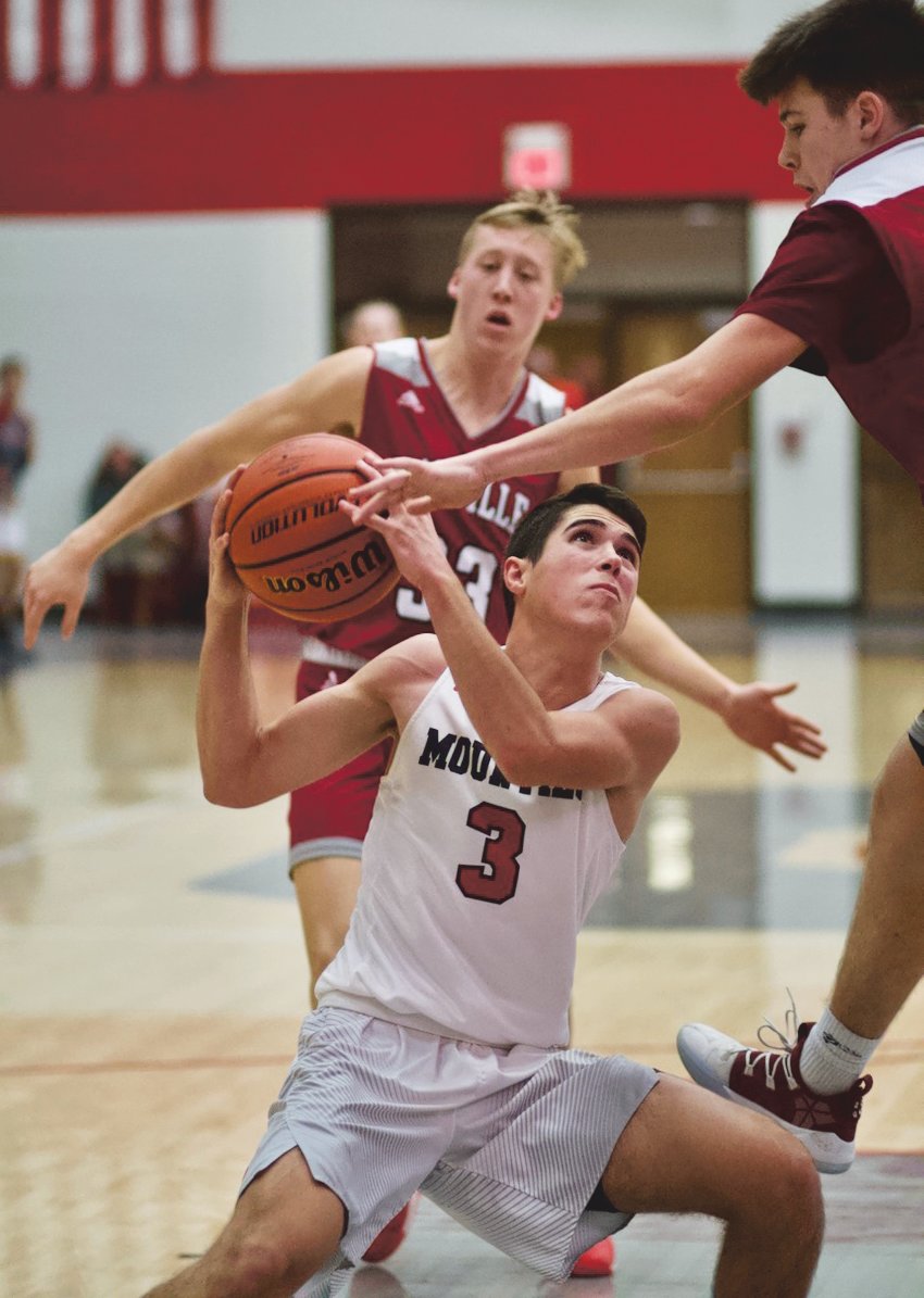 Southmont's Drew Glancy looks to break through a pair of Danville defenders in a game earlier this season.