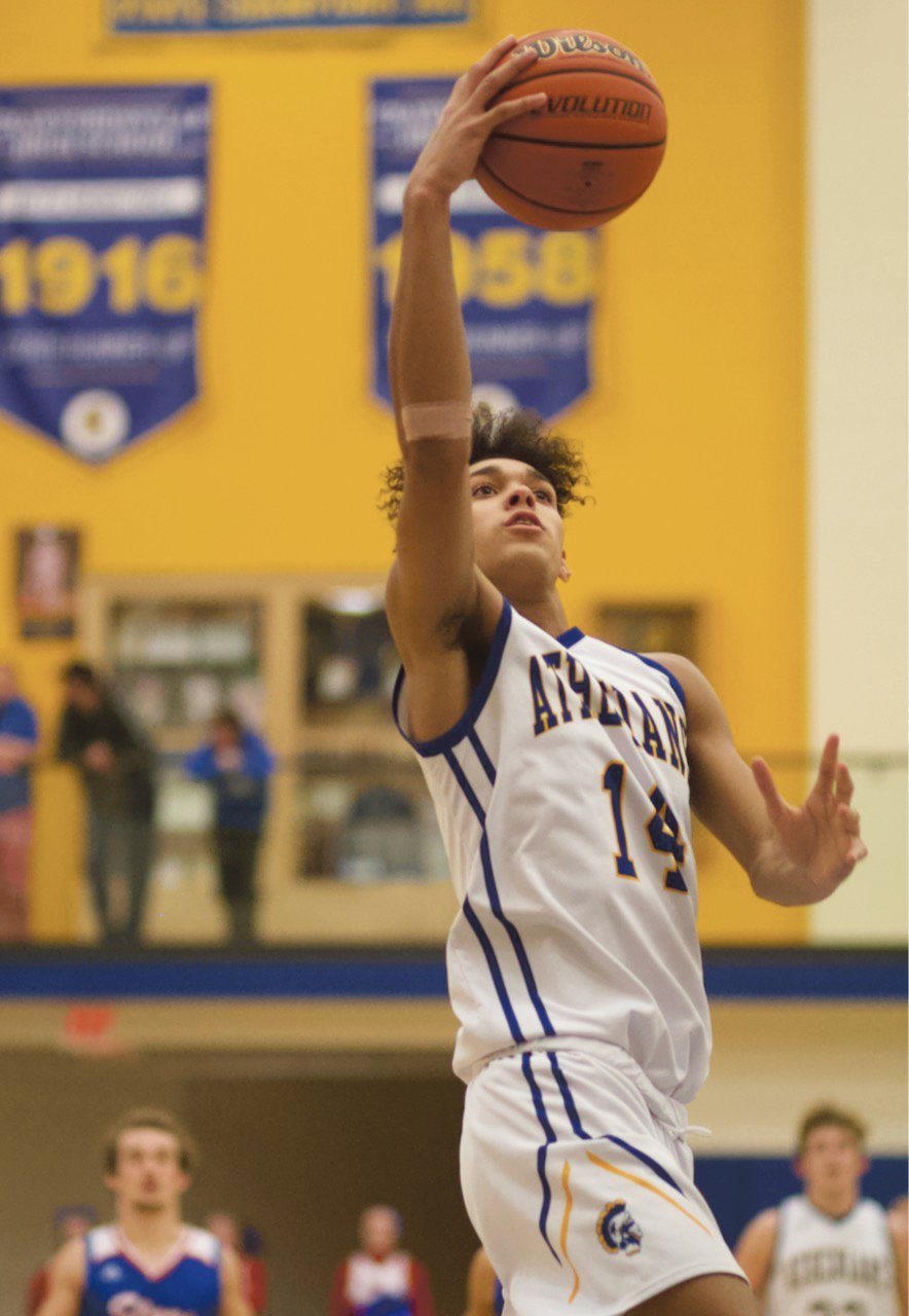 Crawfordsville's Jesse Hall scoops in for a lay-up in the Athenians 59-54 loss to Western Boone.