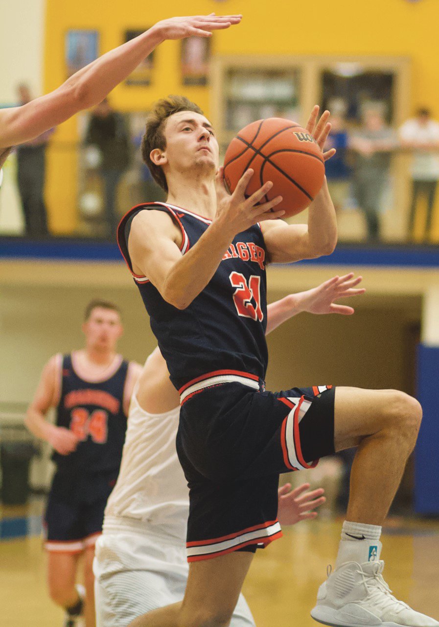 North Montgomery's Kade Kobel drives in for a bucket in the Chargers 66-54 win over Southmont.