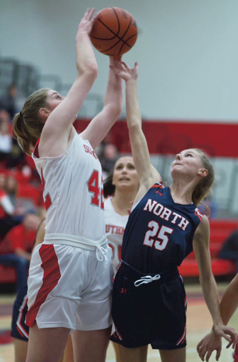 Southmont sophomore Belle Miller grabs a rebound over North Montgomery's Grace McClaskey in a game earlier this season.
