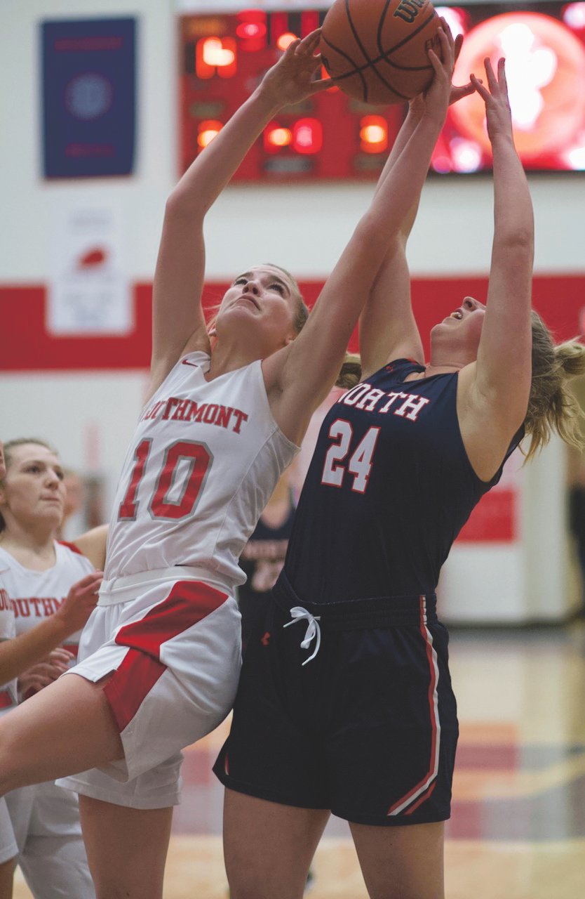 Southmont's Sidney Veatch skies for a rebound over North Montgomery's Sidney Zachary.