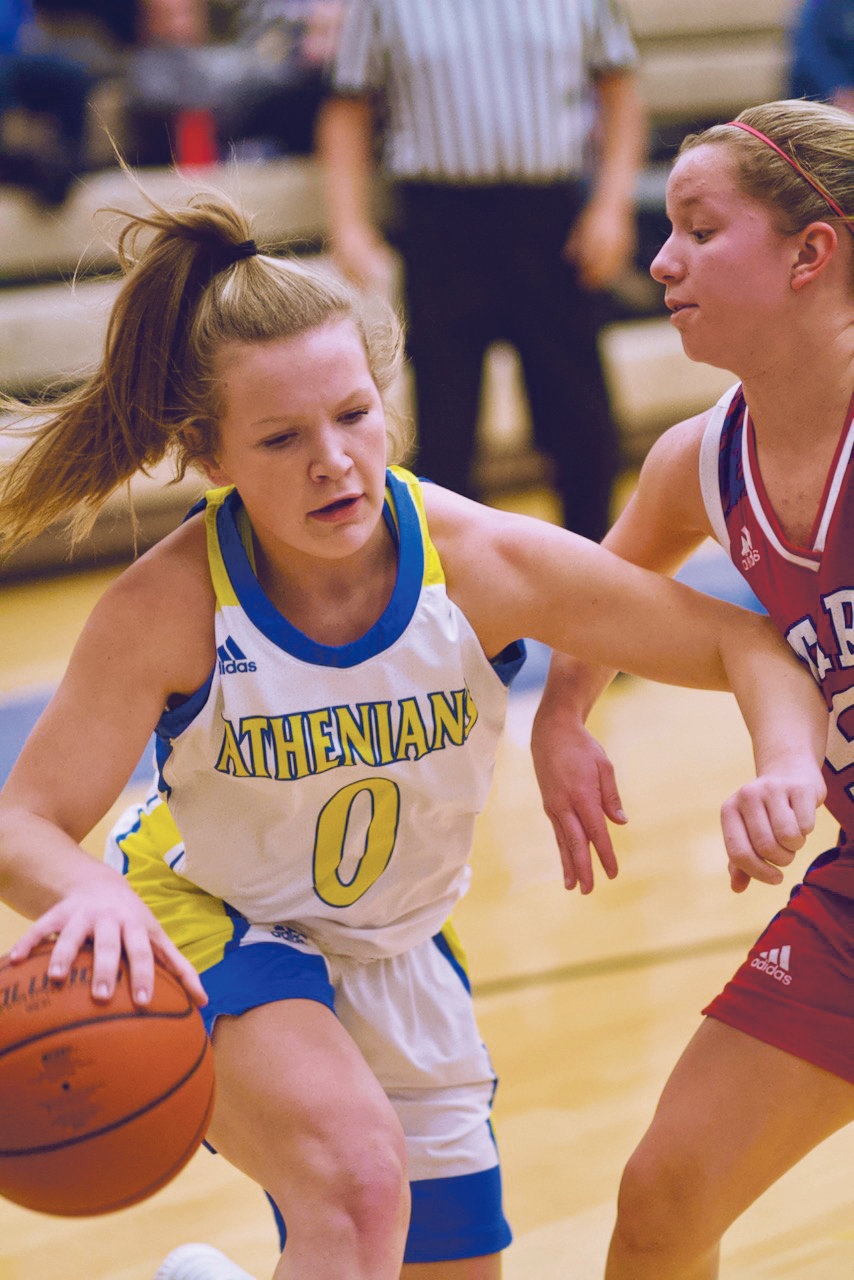 Olivia Reed drives to the hoop for the Athenians in a 40-31 loss to Western Boone on Tuesday night.