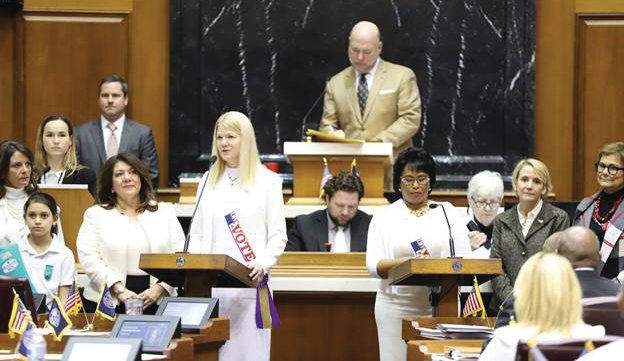 State Rep. Sharon Negele (R-Attica) (podium, left) commemorates the 100th anniversary of Indiana ratifying the 19th Amendment to the U.S. Constitution on Thursday, Jan. 16, 2020, at the Statehouse in Indianapolis. Indiana was the 26th state to ratify the amendment, which was officially adopted on Aug. 26, 1920. Lawmakers and guests from many backgrounds and generations celebrated the occasion with a special a presentation on the House floor. In 2019, Negele authored a law creating the Women