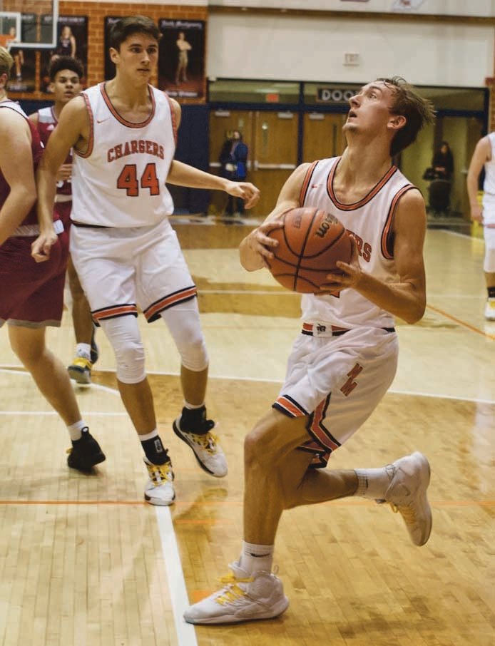 North Montgomery's Kade Kobel drives open for a lay-up in the first half against Danville.