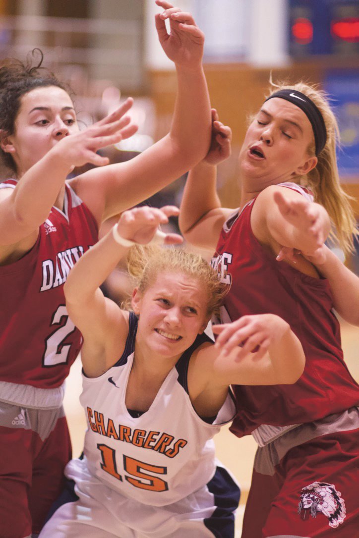 North Montgomery's Madi Welch is swarmed by a pair of Danville defenders.