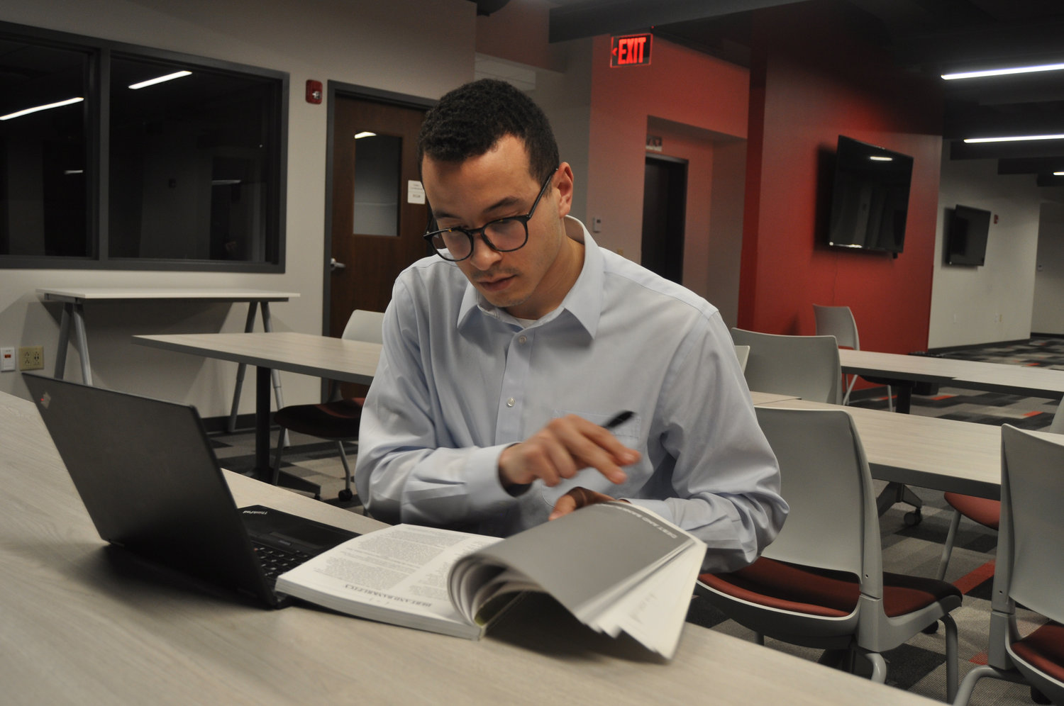 Attorney Zach Mahone does paperwork Wednesday at the Montgomery County Free Legal Clinic at Fusion 54. The clinic offers pro bono advice on civil matters such as family law and specialized driving privileges.