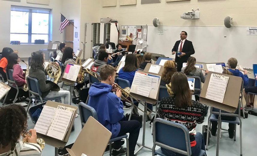 Eddie Guanajuato, standing, instructs his class as band director at Crawfordsville Middle School; Guanajuato has been teaching music for 31 years and said he has never received "such generosity, until now."