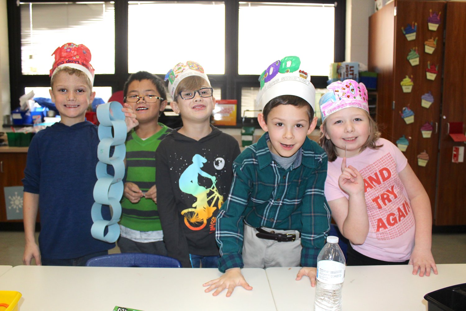 Taking a break from their 100-link paper chain project during their 100th day of the 2019-20 school year Wednesday at Hose Elementary are: First-grade students Gavin Cope, 7; Adam Tran, 6; Wylder Norwood, 7; Jonah Kiefer, 7; and Ashtyn Green, 7.