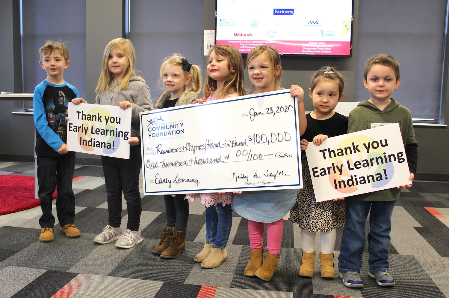Sauyer Stacey, from left, Elle Collins, London Trent, Abraelynn Waye, Oaklee Parker, Emma Pack and Christopher WIlliams thank Early Learning Indiana and the Montgomery County Community Foundation on Thursday at the Fusion 54 building.