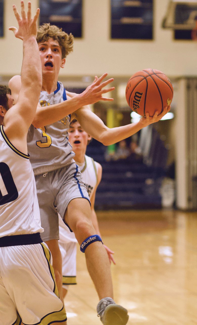 Crawfordsville's Ty Lynas drives in for a lay-up against Fountain Central.