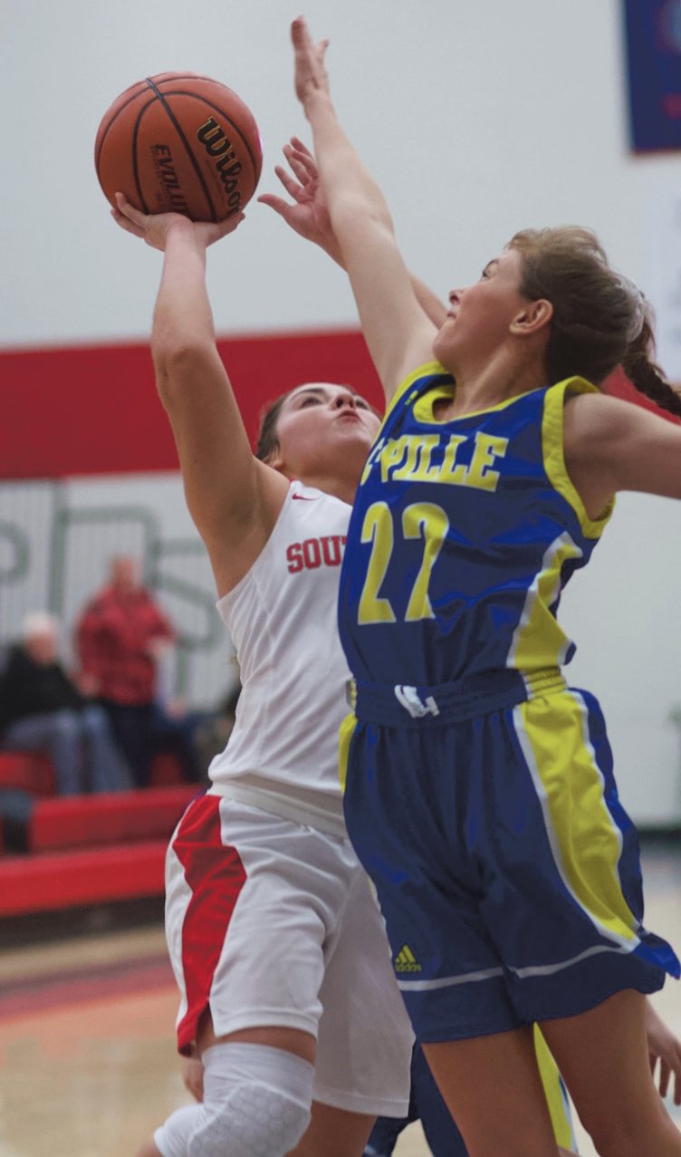 Southmont's Bailey Thompson drives in on Crawfordsville's Peyton Sinnet.