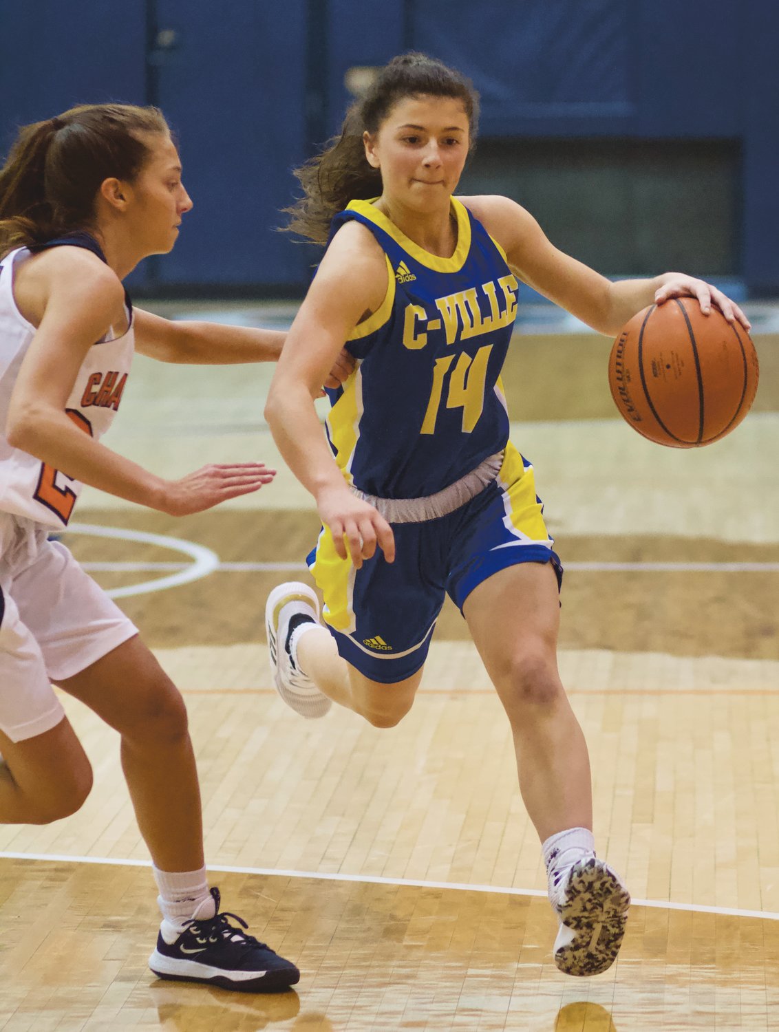Crawfordsville's Shea Williamson drives past North Montgomery's Maddie Moseley in a game earlier this season. The Athenians will play Danville in the sectional, while the Chargers will open with Frankfort.
