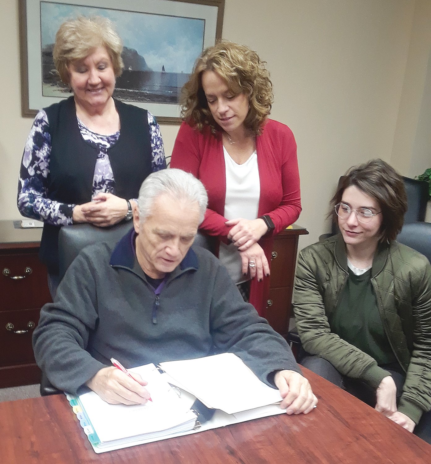 Board members, S David Long, Janet Jersey, Julia Perry and Shelbi Hoover review applications.