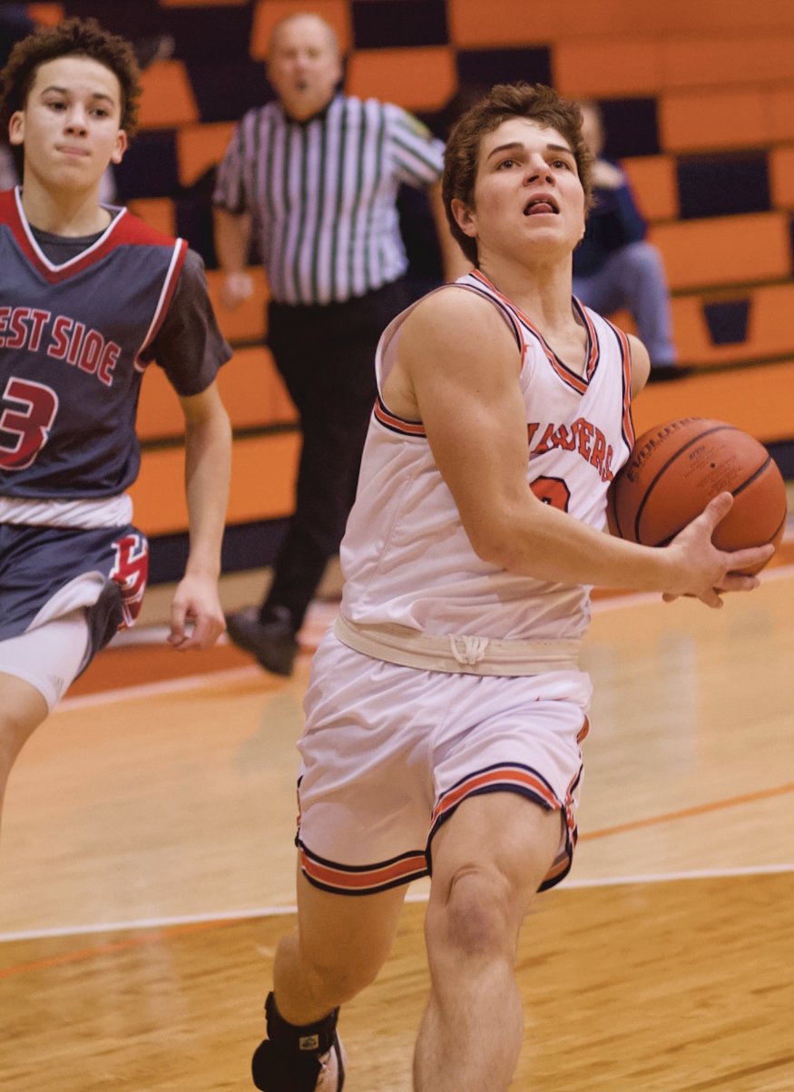 North Montgomery's Logan Kelly drives to the basket during a 56-55 Charger loss to West Lafayette.