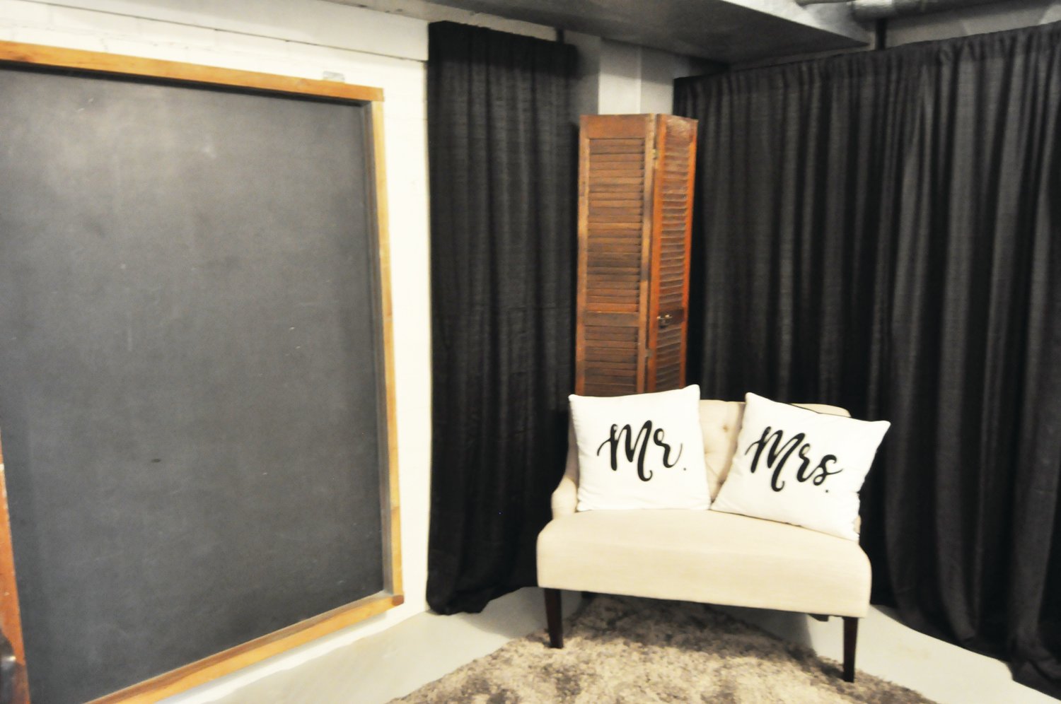 A dressing area at the Historic Lutheran Church Event Center features a chalkboard found in the church, which closed in 2018.