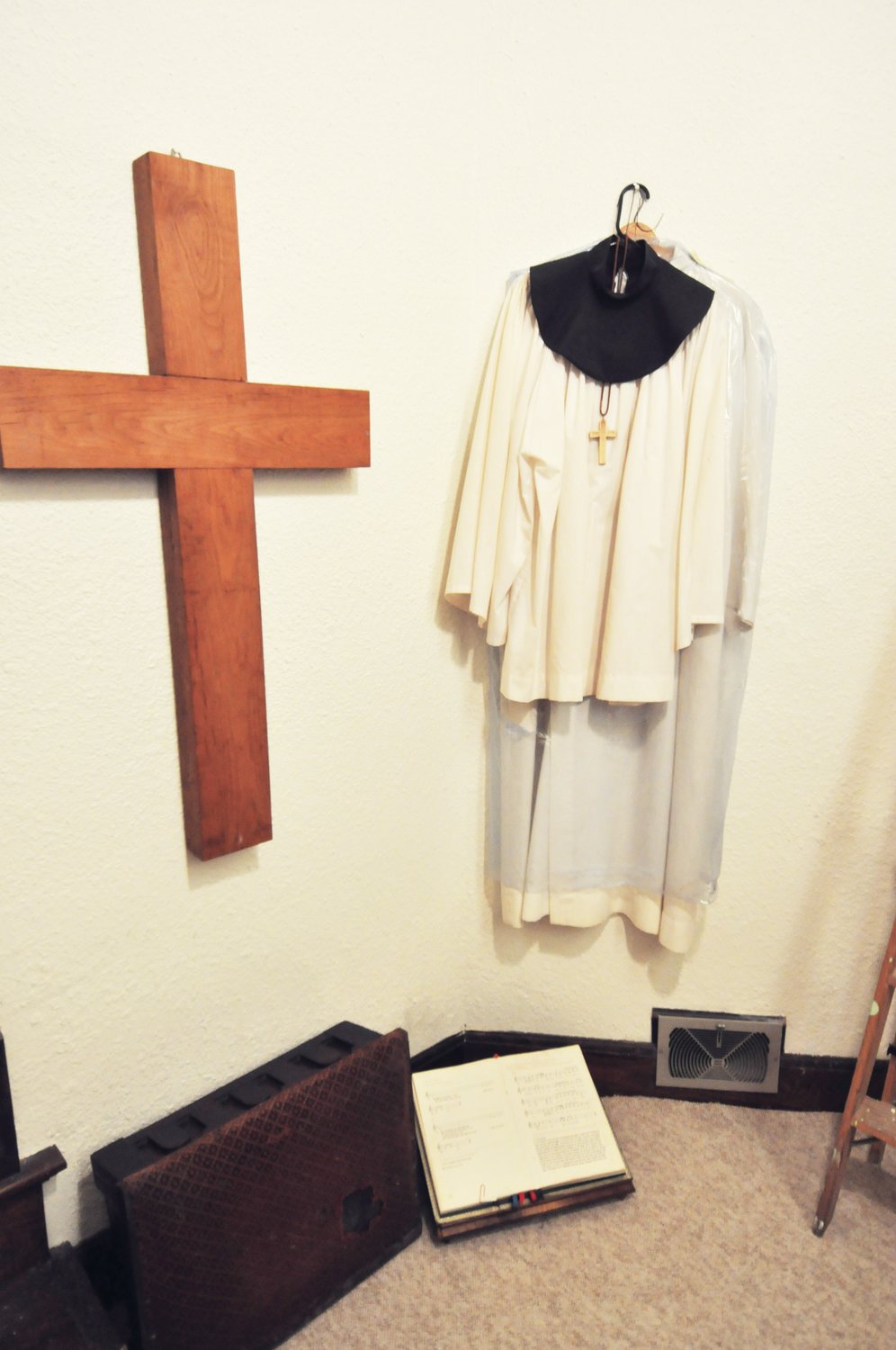 A minister's robe, cross and hymnal are among the historical artifacts being preserved at the Historic Lutheran Church Event Center. The church was built in 1917 and closed in 2018.