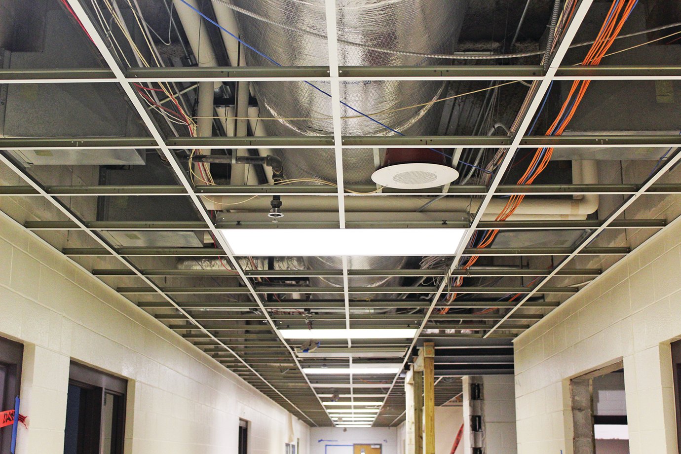 With ceiling tiles removed to expose wiring for workers, the northwest hallway on the first floor of  Crawfordsville High School is hardly recognizable.