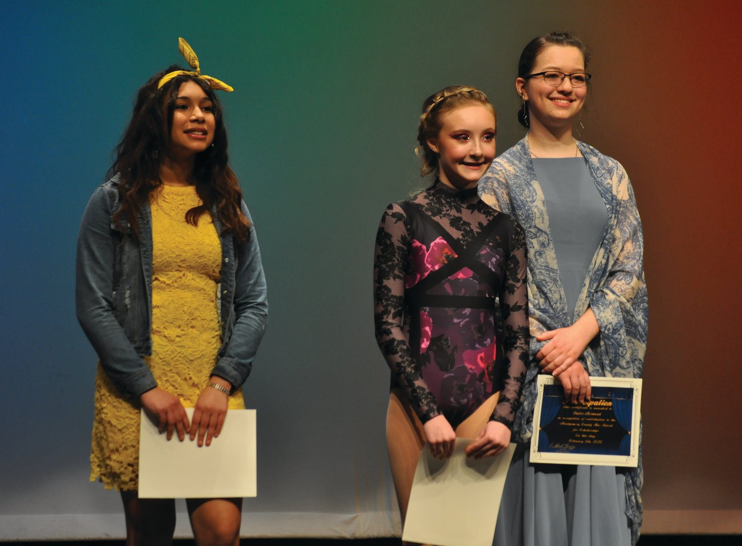 MoCo's Got Talent for Scholarships winner Dericka Jeffers, center, is flanked by second place finisher Angelina Leon-Leyva and third place finisher Taylor Mermoud Saturday at Crawfordsville High School.
