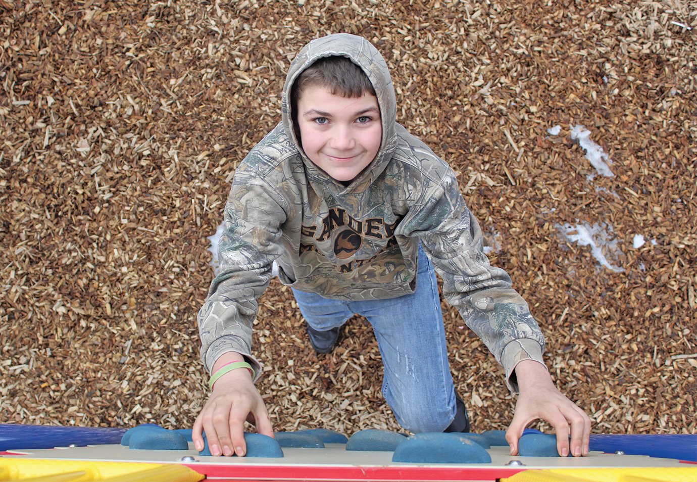 Parke Heritage Middle School student Conner Paxton, 13, enjoys the rock climbing wall at Milligan Park on Presidents Day alongside two siblings and a friend while his parents visit a Crawfordsville tire shop. Students around the country were out of school Monday, freeing them up for their favorite activities.