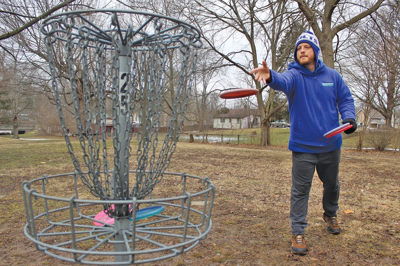 Parks and Recreation personal trainer Jerimiah Adams, 34, takes advantage of a near-empty Milligan Park on Monday to hone up on his disc golf skills. Adams regularly participates in year-round disc golf tournaments, including the ongoing Wintry Indiana Frozen Fundraiser series and the Professional Disc Golf Association.